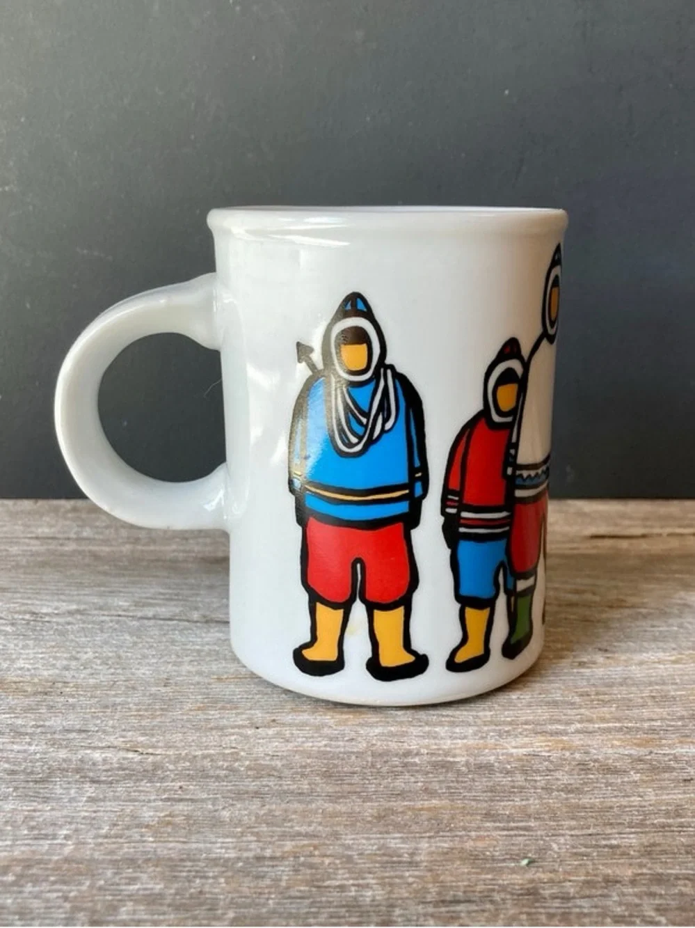 Marc Tetro coffee mug featuring Inuit family artwork by Danesco.